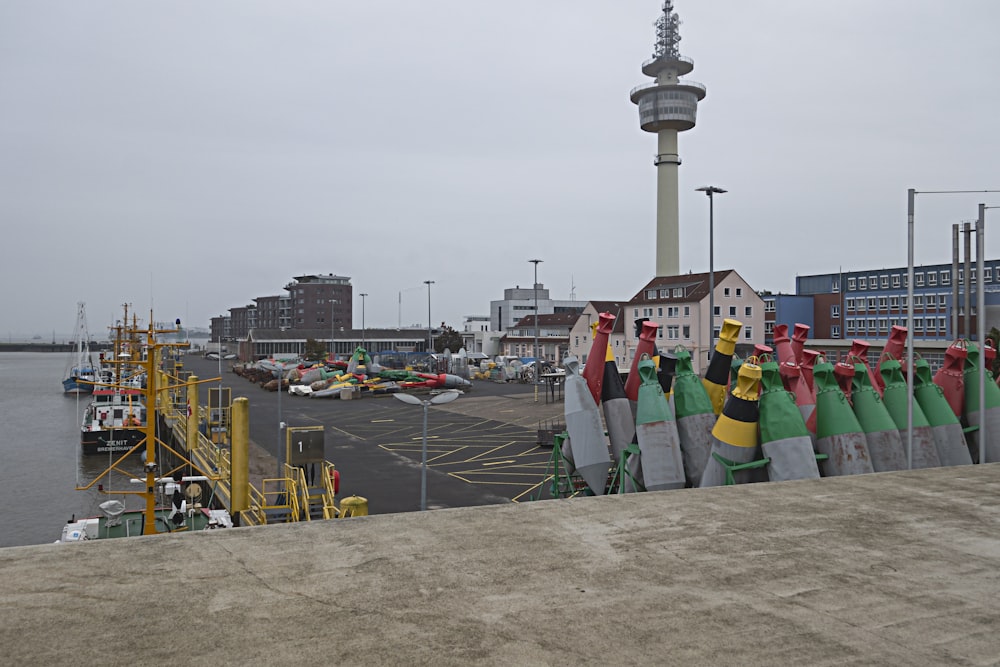 a group of buoys sitting on the side of a road