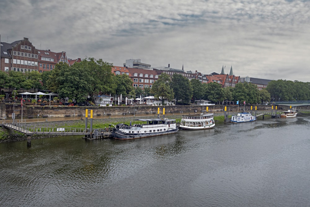 a group of boats that are sitting in the water