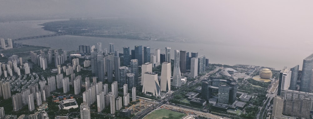 an aerial view of a city and a body of water