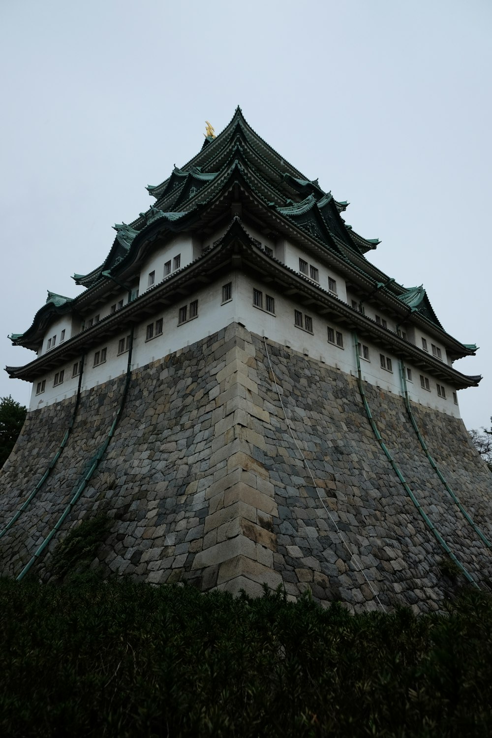 a tall brick tower with a clock on top of it