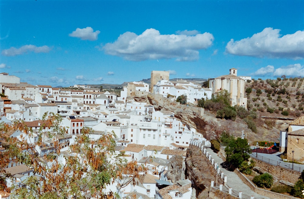 a view of a city with white buildings