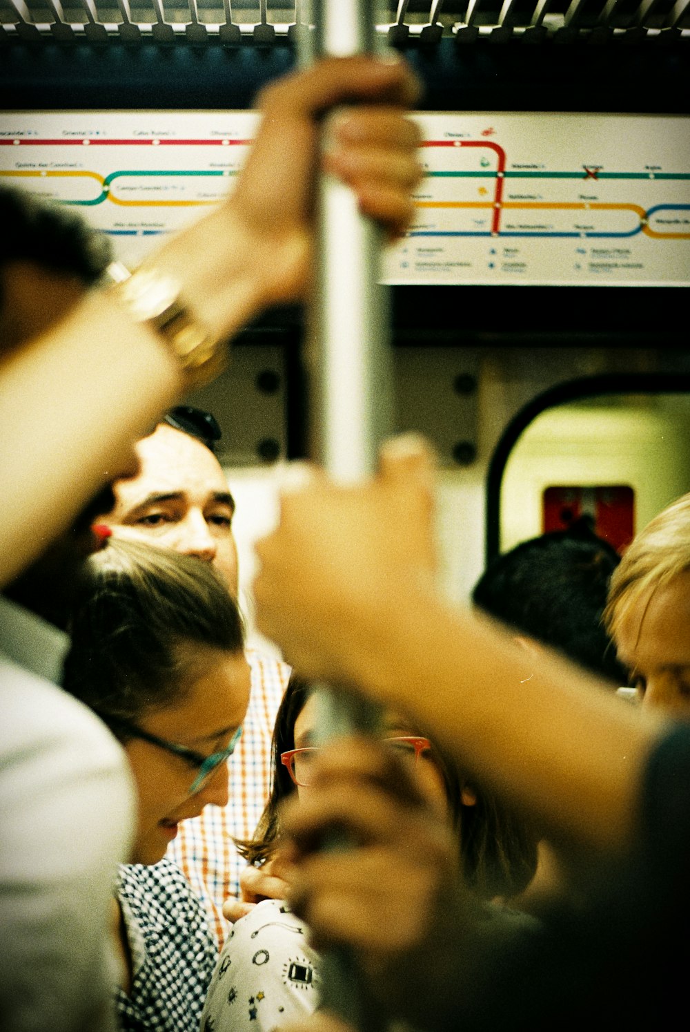 a group of people riding a subway train