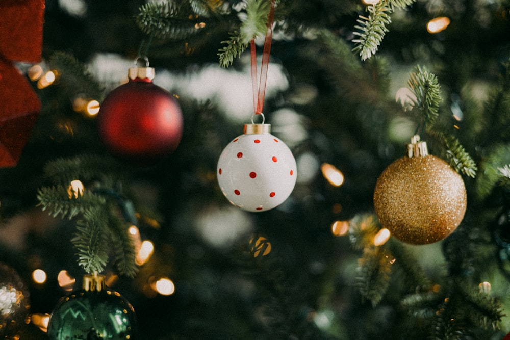 a close up of a christmas tree with ornaments