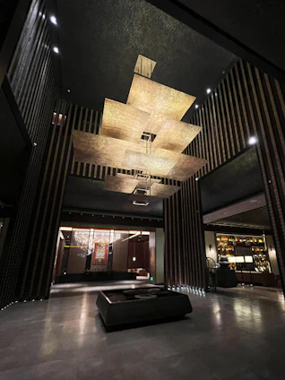 A sleek, modern office space with subtle golden accents reflecting a premium branding agency atmosphere.