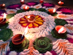 Colorful garlands and vibrant rangoli powders arranged gracefully for festival celebrations.