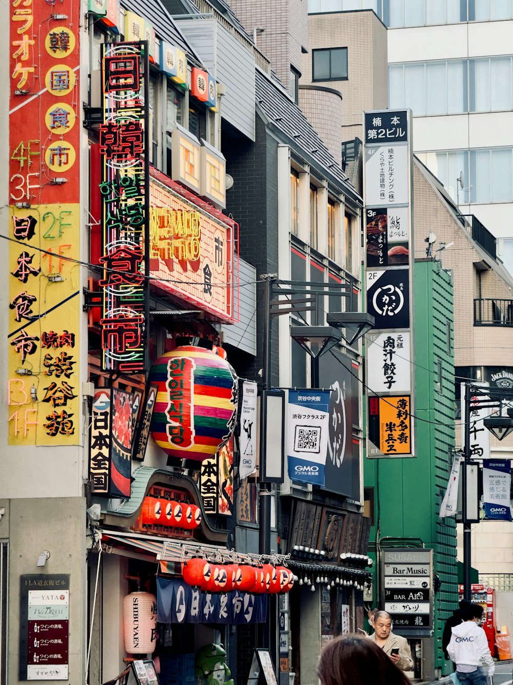 a city street filled with lots of tall buildings