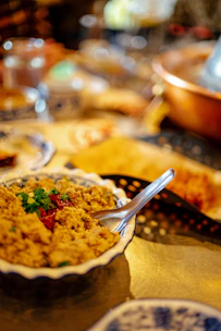 Close-up of a vibrant Dominican mofongo dish garnished with fresh herbs on a rustic wooden table.