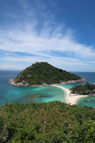 A picturesque island with clear blue waters and sandy beaches.