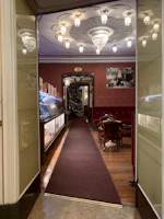 Warmly lit interior of Whitley Bay Masonic Hall set up for a private event with elegant decorations.