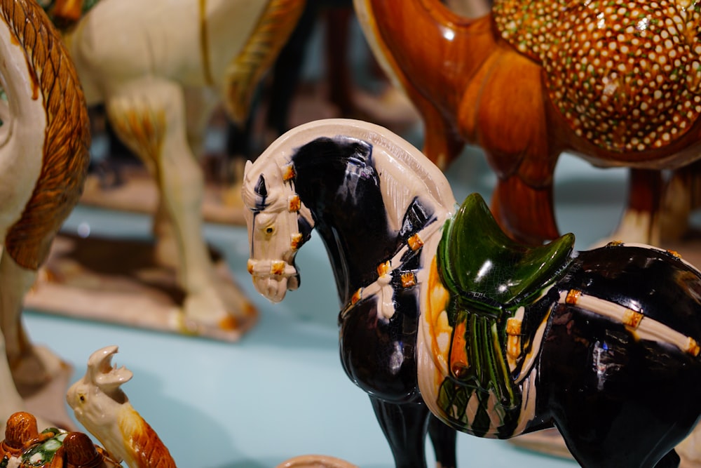a group of horse figurines sitting on top of a table