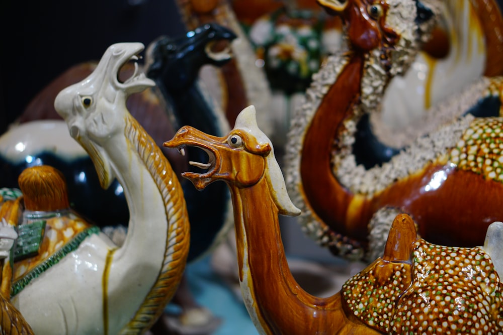 a group of ceramic animals sitting next to each other