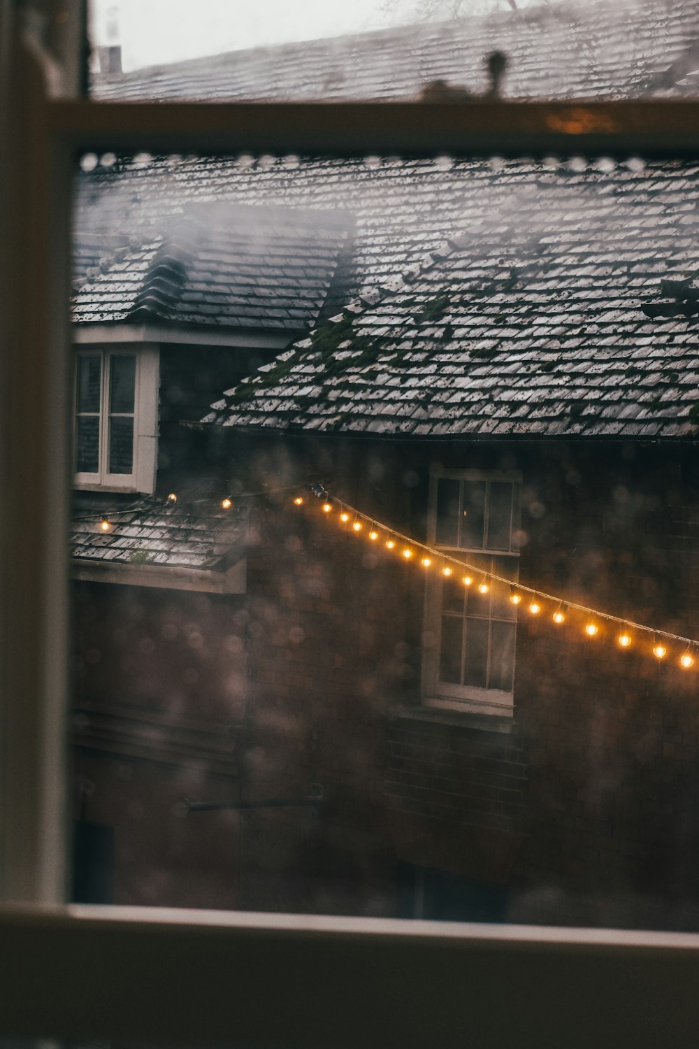 a window with a string of lights on it