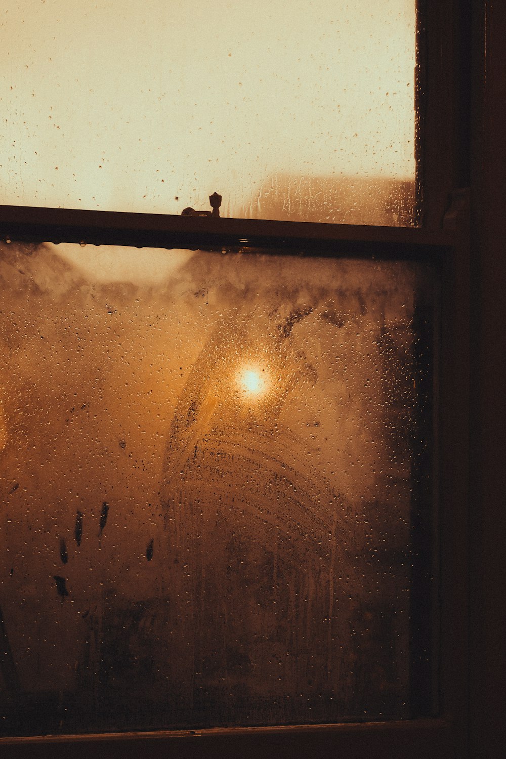 a window with a view of a ferris wheel