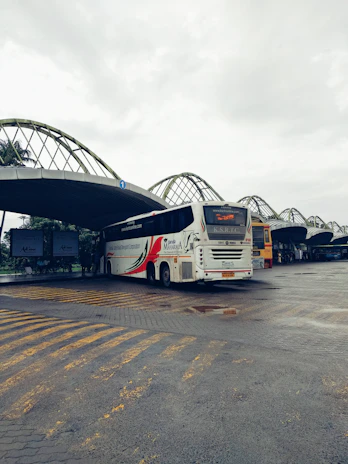 Front view of a vibrant bus from a popular northern bus company at the central station