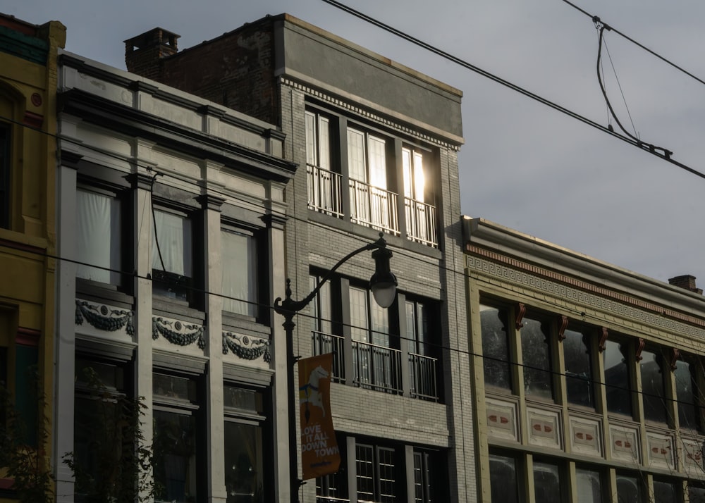 a row of buildings next to each other on a cloudy day