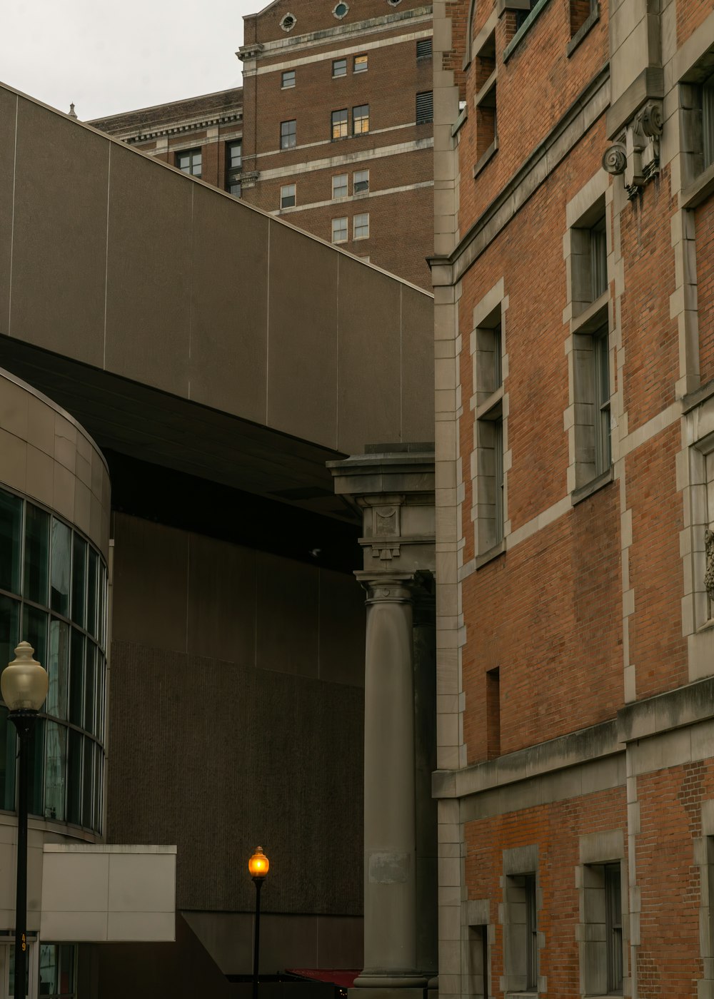 a street light in front of a brick building