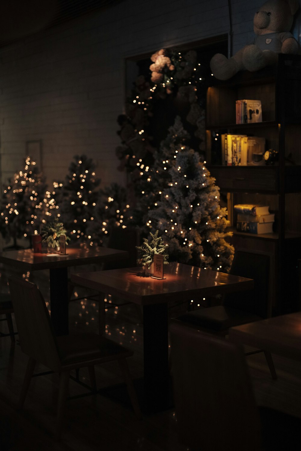 a dining room with a christmas tree in the corner