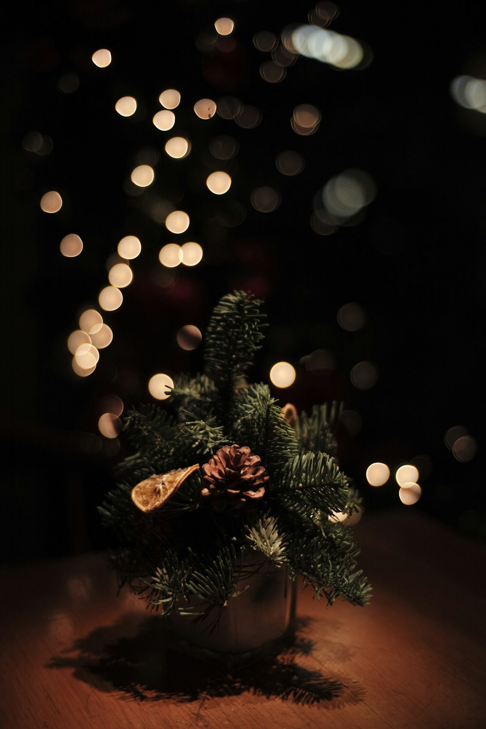 a small christmas tree is sitting on a table