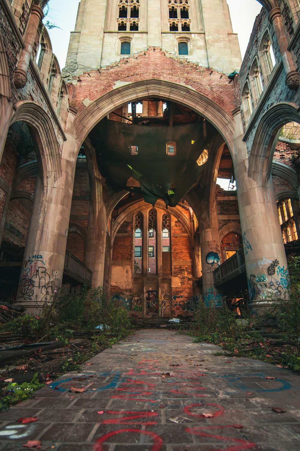 an abandoned building with graffiti on the floor