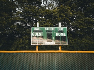 A scoreboard showing the current score of a youth softball game