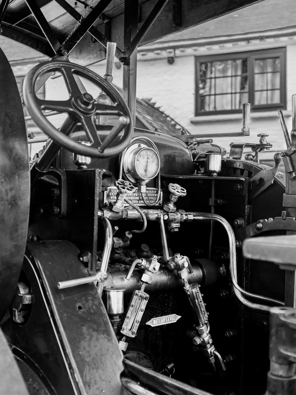 a black and white photo of an old car