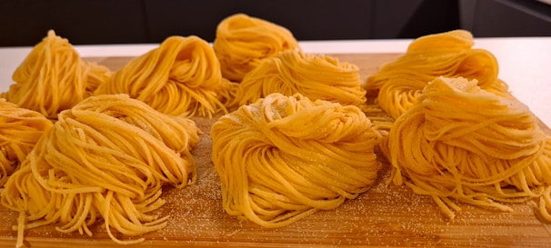 Stacks of neatly packaged fresh pasta ready for delivery in a temperature-controlled facility.