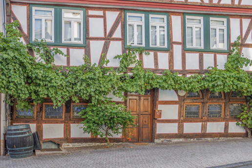 A cozy Airbnb rental in Troyes with charming half-timbered architecture visible outside the window.
