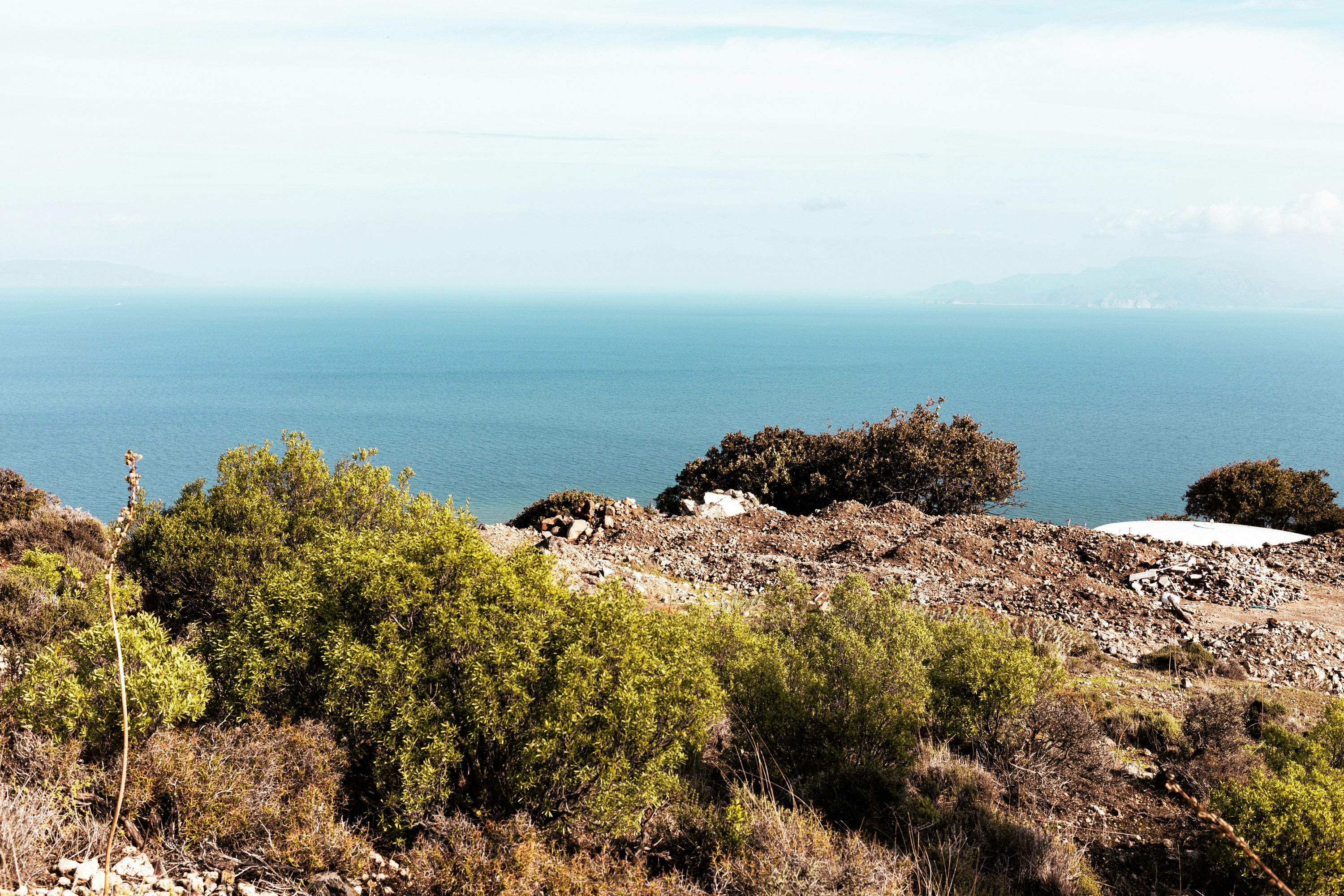 a view of a body of water from a hill