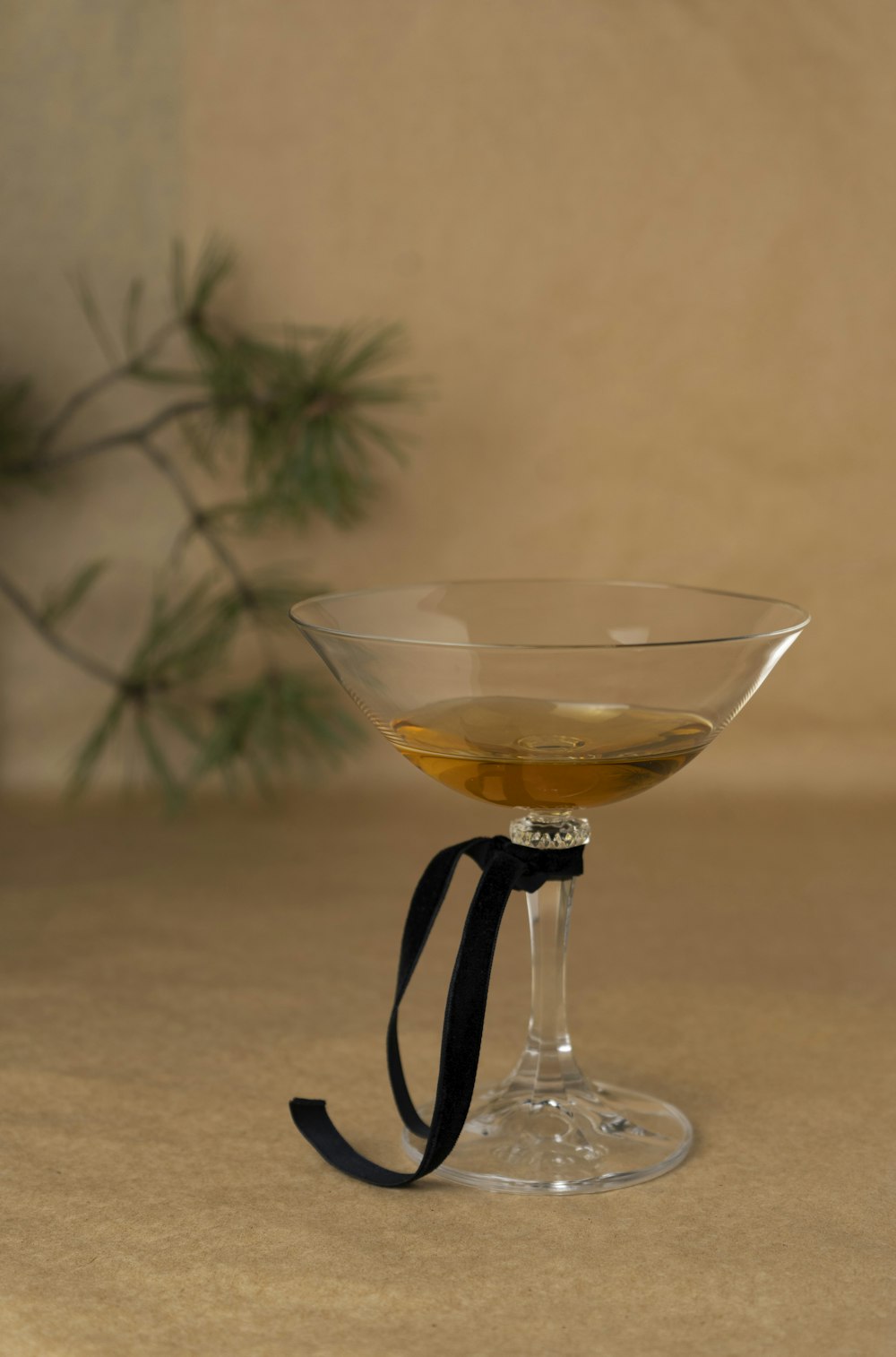 a wine glass with a black ribbon around it