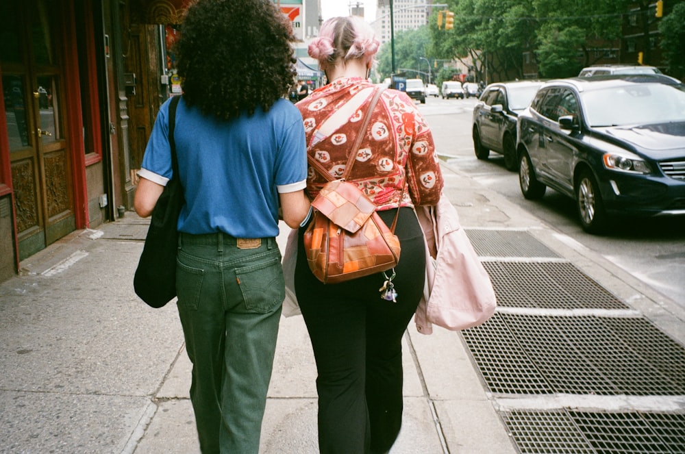 a man and a woman walking down the street