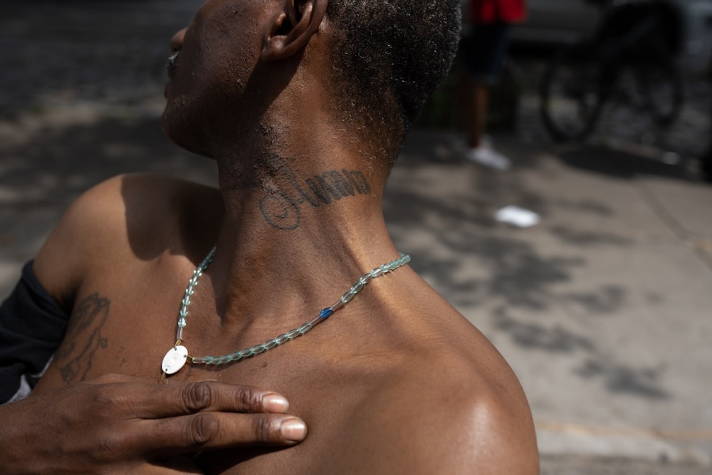 a man with a tattoo on his chest