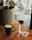 Close-up of a QR code sticker on a café table with a happy customer scanning it