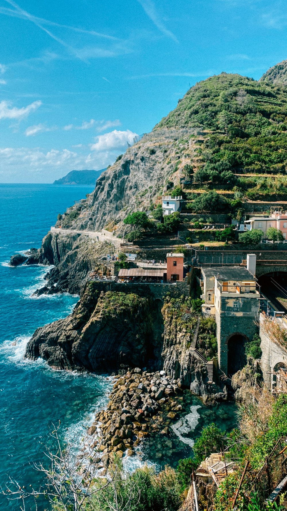 a scenic view of the ocean and a mountain