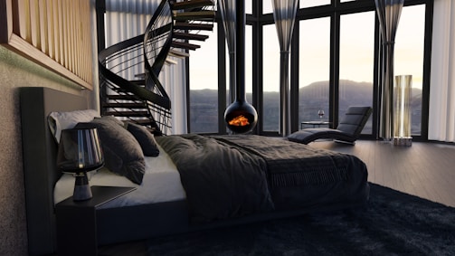 a bedroom with a spiral staircase in the corner