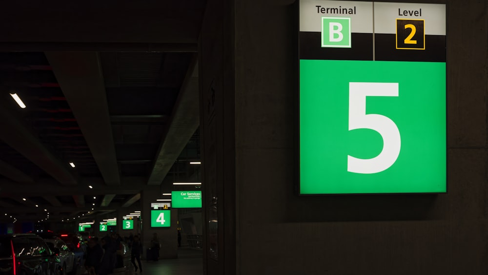a green and white sign that says terminal level 5