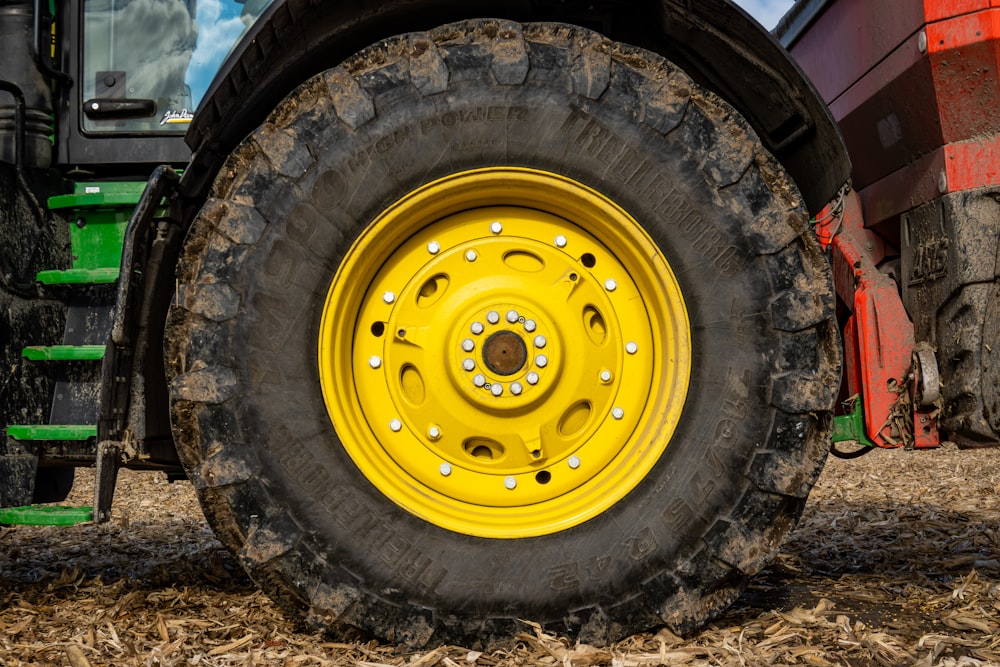 a close up of a tractor tire on a farm
