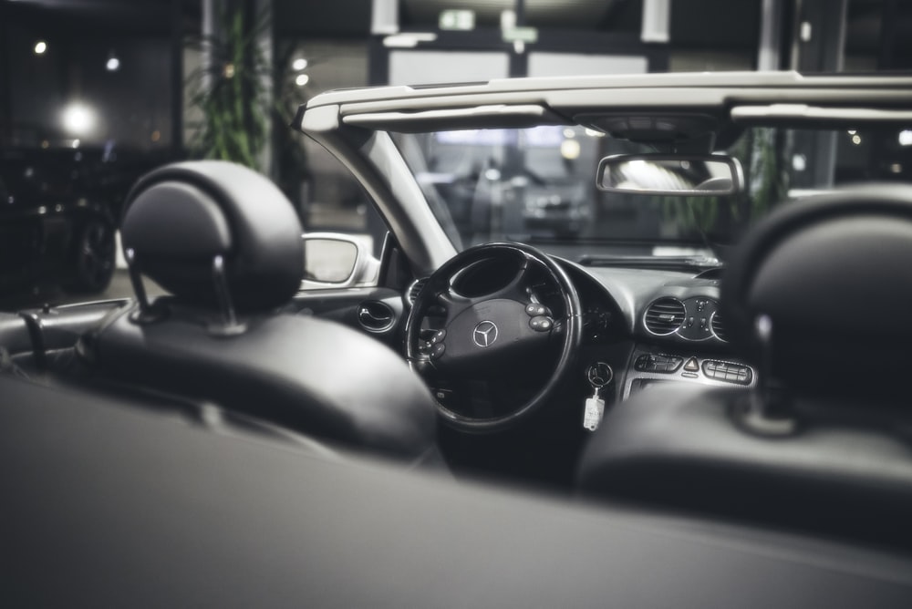 a black and white photo of a car dashboard