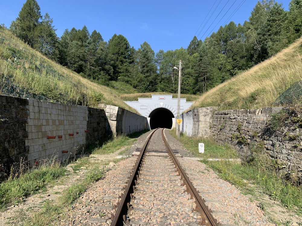 a train track going into a tunnel
