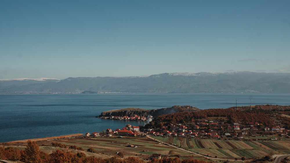 a view of a town and a body of water