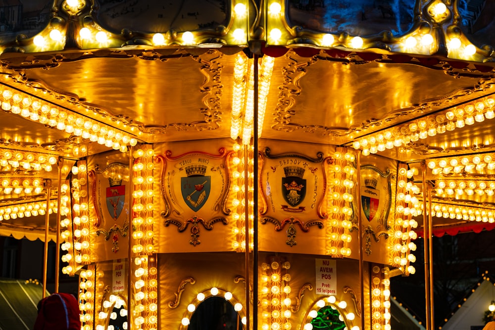 a merry go round is lit up at night