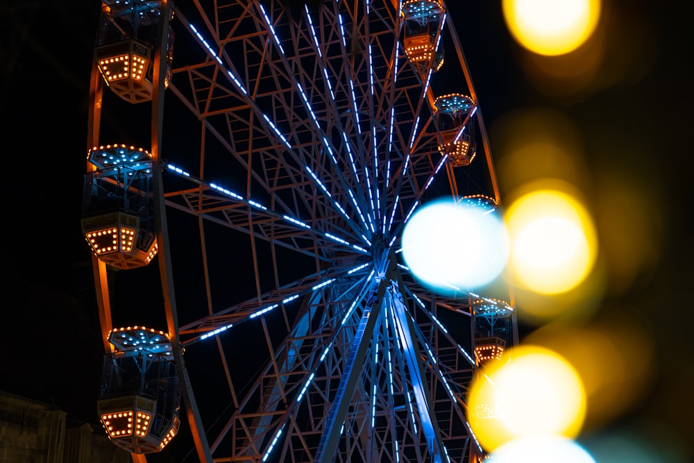 a large ferris wheel lit up at night