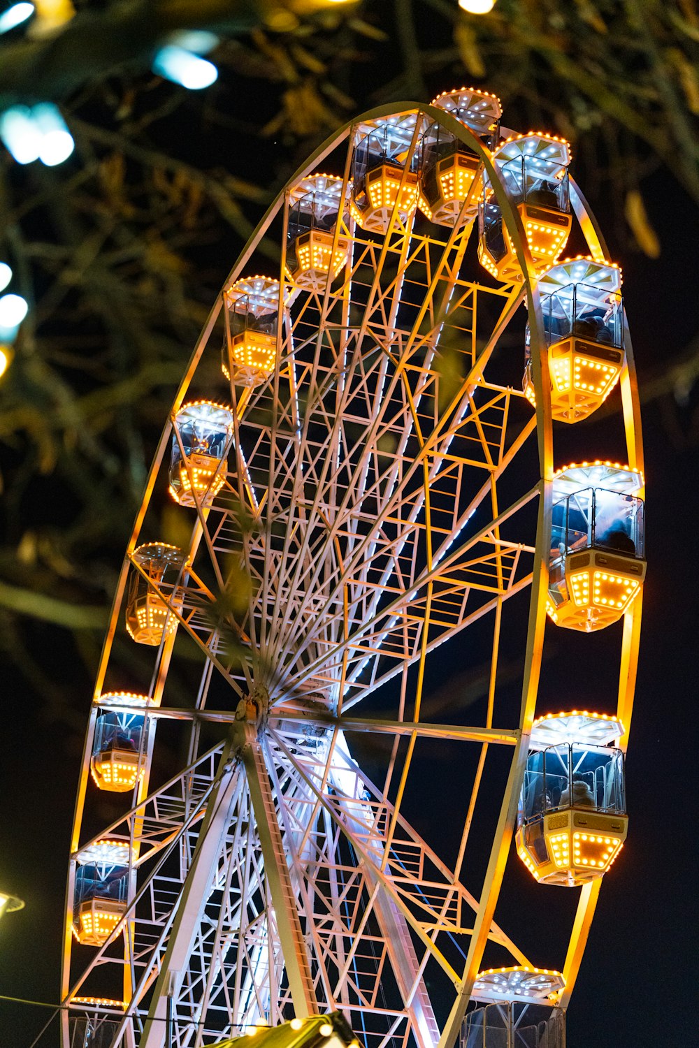 a ferris wheel lit up in the night sky