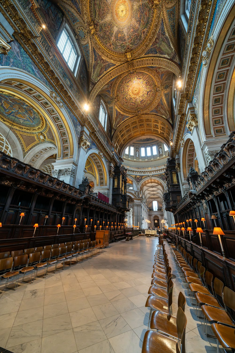 a church with a vaulted ceiling and wooden pews