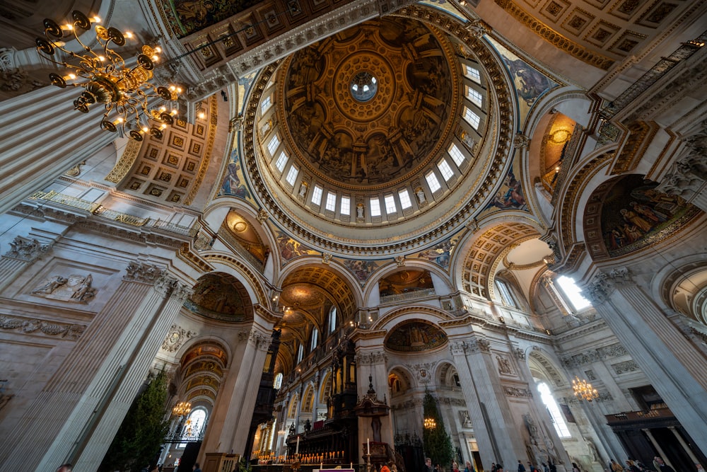 a church with a dome ceiling and chandelier