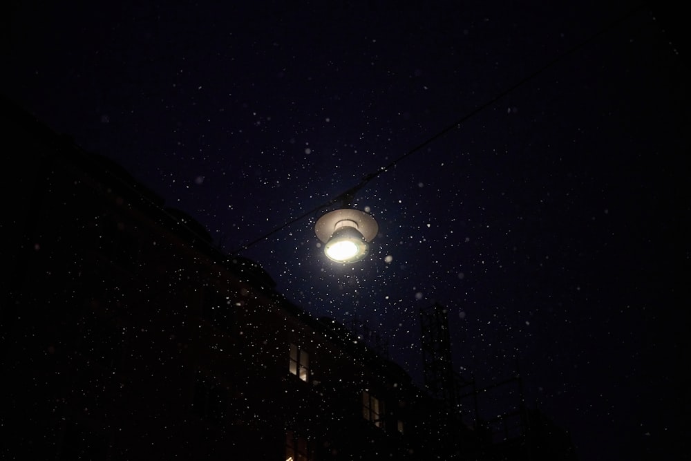 a street light on a dark street at night