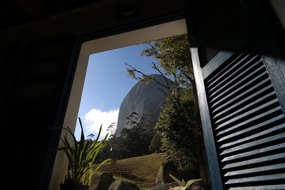 a view of a mountain through a window