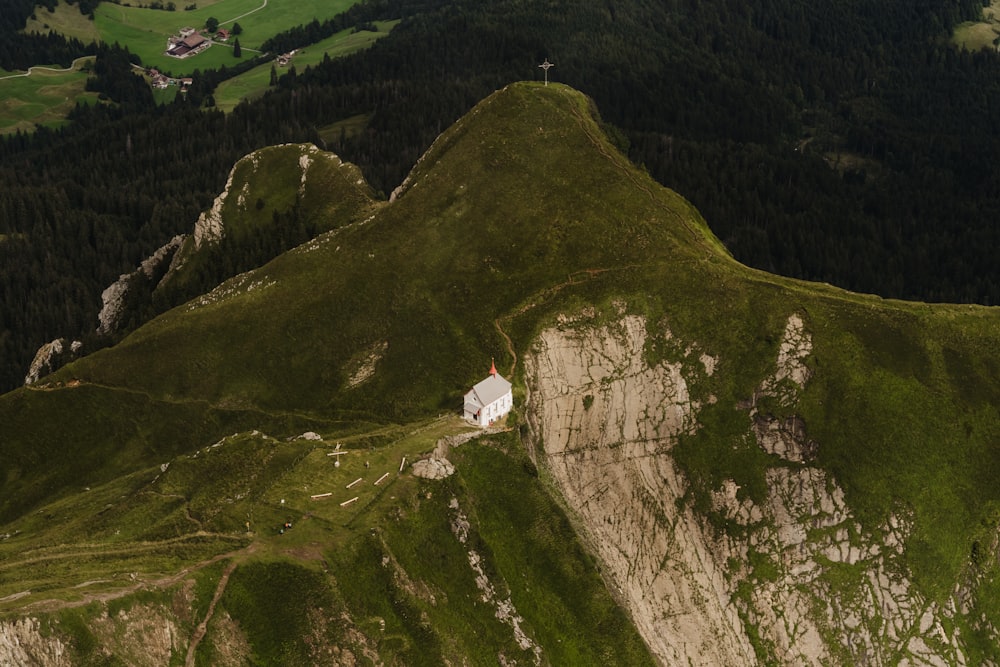 a mountain with a house on top of it