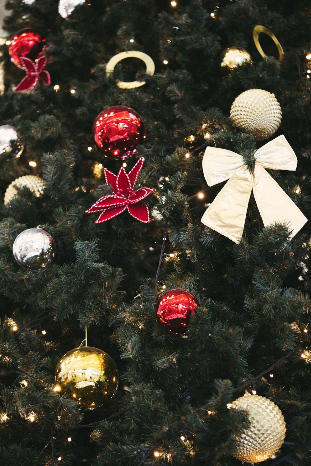 a close up of a christmas tree with ornaments