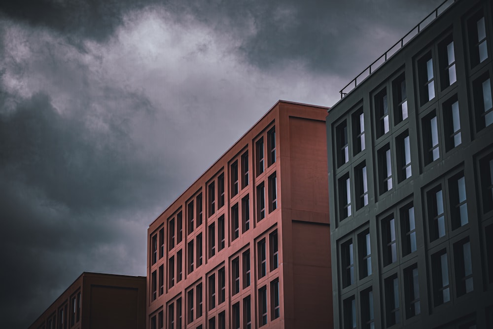 a tall building with windows and a sky background