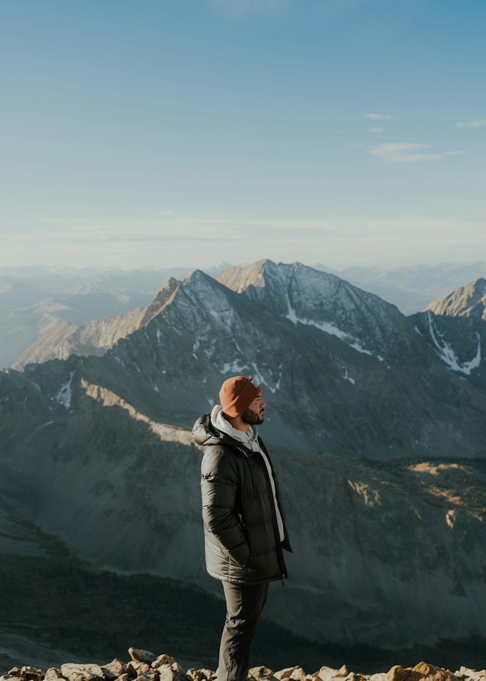 a man standing on top of a mountain